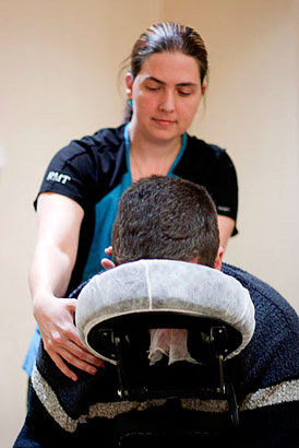 Carrie Deslippe, RMT performing chair massage on the 2011 Dancing with the Local Stars opening night. Photo courtesy of Gordana Mladenovic